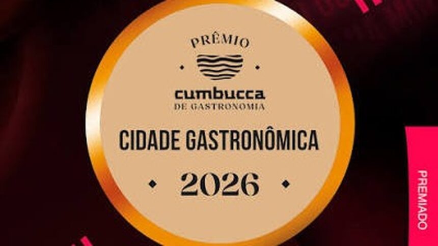 Selo dourado do Prêmio Cumbucca de Gastronomia com texto 'Cidade Gastronômica 2026', 'Premiado' lateral